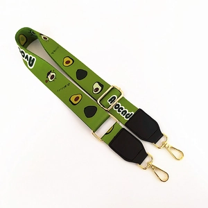 Adjustable green wide bag strap with cute avocado pattern and gold metal hooks