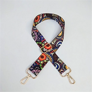 Detail of bohemian mandala fabric strap with adjustable gold metal buckle and lobster clasp
