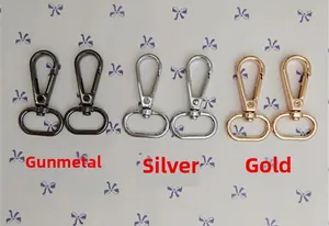 Detail showing metal lobster clasps in gunmetal, silver, and gold for shoulder bags