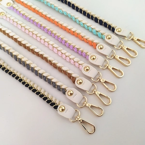 Close-up of colorful woven handbag wrist straps with gold lobster clasps in 8 colors