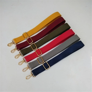Detail of adjustable cotton canvas bag straps with gold metal hardware in various colors