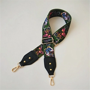 Adjustable wide replacement bag strap with colorful butterfly pattern and gold hardware