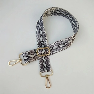 Adjustable faux snake skin shoulder strap with gold metal lobster clasps for handbags