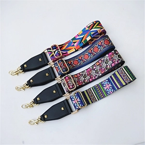 Detail of colorful adjustable wide shoulder straps with ethnic patterns and gold hardware