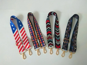 Detail showing four assorted woven shoulder straps with vintage patterns and gold metal hooks