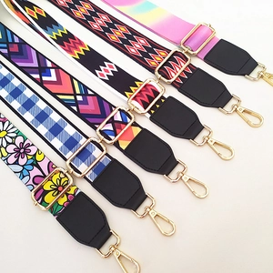 Detail of ethnic style embroidered replacement straps with gold metal hooks and buckles