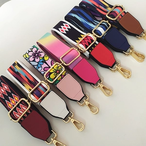 Close-up of assorted colorful ethnic style woven bag straps with gold metal hardware