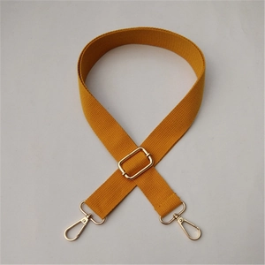 Adjustable mustard yellow cotton canvas shoulder strap with polished gold metal hardware
