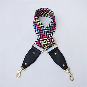 Close-up of adjustable colorful chevron shoulder strap with gold hardware and rivets
