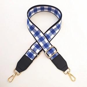 Blue and white gingham woven strap with gold metal hooks and adjustable buckle detail