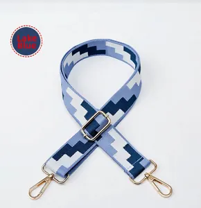 Detail of adjustable lake blue woven geometric replacement strap with gold metal hooks