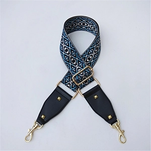 Detail of adjustable blue and black ethnic weave strap with gold lobster clasps and studs