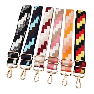 Set of six adjustable canvas shoulder straps with colorful geometric patterns and gold hardware