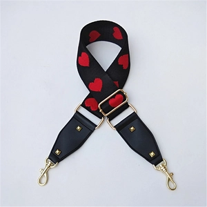 Adjustable black shoulder strap with red heart embroidery and golden metal hardware