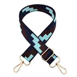 Adjustable woven shoulder strap with geometric blue and coffee patterns and gold hooks