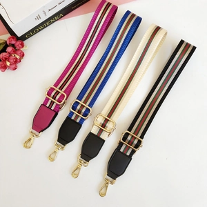 Adjustable wide replacement bag straps in colorful striped patterns with gold metal hooks