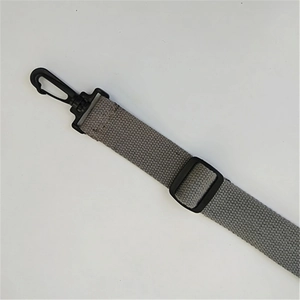 Close-up of gray adjustable canvas shoulder strap with black plastic swivel lobster hook