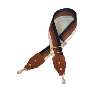 Adjustable wide nylon bag strap with striped pattern and gold lobster clasps