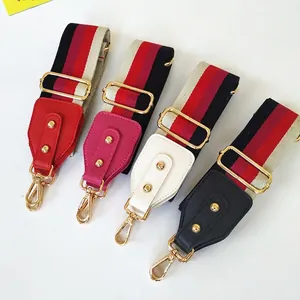 Adjustable wide striped fabric shoulder straps for handbags with gold metal hooks