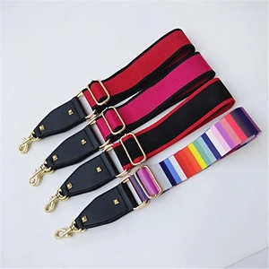 Adjustable colorful woven bag straps with gold hardware on a white background