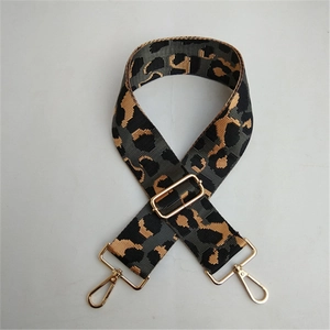 Adjustable leopard print bag strap with durable grey fabric and gold metal lobster clasps