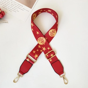 Adjustable red ethnic style bag strap with gold star patterns and metal buckles