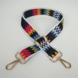 Close-up of colorful zigzag pattern woven strap with premium gold metal buckles