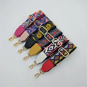 Detail of colorful ethnic woven bag straps with gold metal hardware adjusters