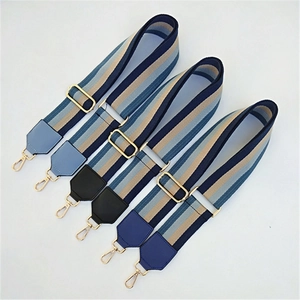 Adjustable striped wide shoulder strap with gold metal hooks and leather reinforcement