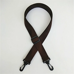 Detail of dark brown thick nylon strap with adjustable black plastic swivel hooks