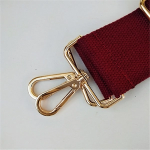 Wide burgundy replacement shoulder strap with polished gold metal swivel hooks for handbags
