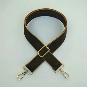 Adjustable wide shoulder strap with brown and khaki weaving and gold metal hooks