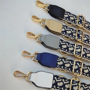 Adjustable woven canvas shoulder straps with vintage floral pattern and gold hardware