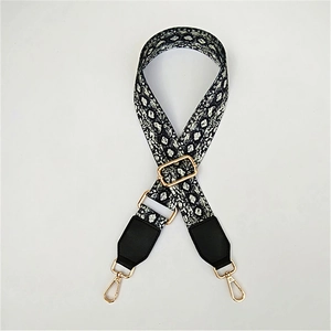 Adjustable snake pattern strap with gold metal buckles and black leather ends