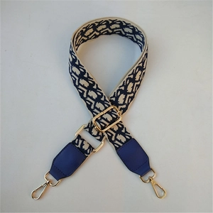 Adjustable navy jacquard strap with gold buckles and dark blue leather details