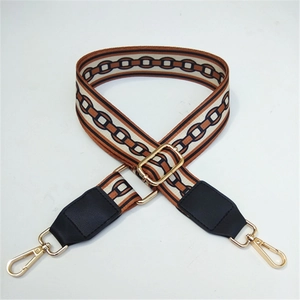 Adjustable wide woven guitar-style shoulder strap with vintage chain pattern and gold hardware