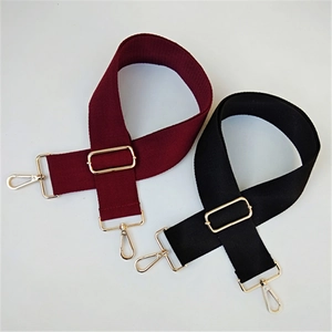 Adjustable wide cotton shoulder straps in burgundy and black with gold metal hooks