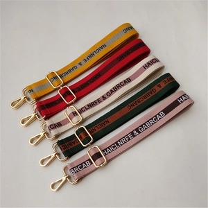 Close-up of five adjustable cotton thick bag straps in vibrant colors with gold hardware
