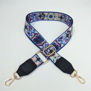 Adjustable wide bohemian shoulder strap with blue floral patterns and gold metal clips