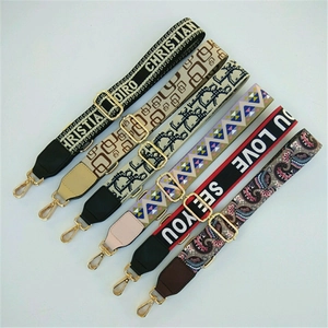 Adjustable wide woven shoulder straps for crossbody bags with gold metal clasps