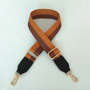 Adjustable wide replacement bag strap with orange and brown stripes and gold hardware