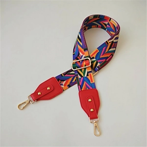 Ethnic style woven strap with geometric patterns in purple and orange with red ends