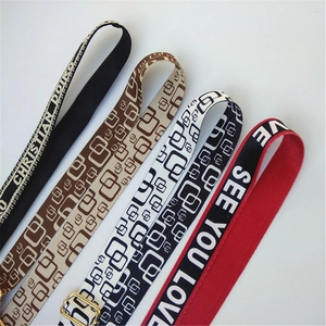Adjustable canvas wide shoulder straps with colorful geometric patterns and gold metal buckles