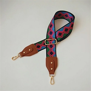 Adjustable woven replacement bag strap with colorful geometric pattern and gold hooks