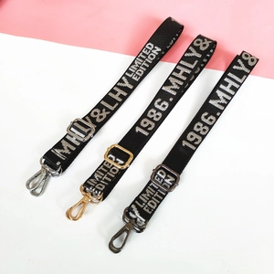 Adjustable nylon shoulder straps with jacquard lettering and metal swivel hooks