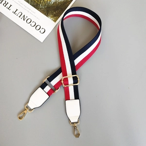Adjustable striped canvas shoulder strap with red, white, blue colors and gold hooks