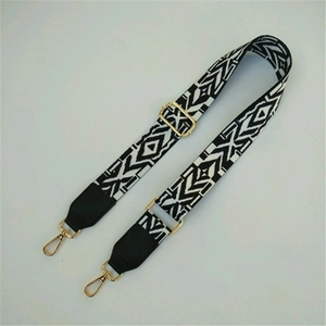 Macro view of adjustable ethnic guitar style strap with black and white patterns