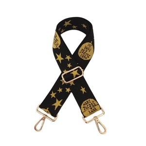 Close-up of adjustable wide woven shoulder strap with gold metal buckles and star patterns