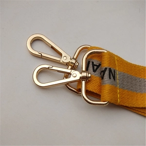 Adjustable yellow canvas shoulder strap with NAPA text and gold metal lobster clasps