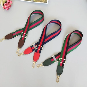 Adjustable wide nylon shoulder straps with ethnic striped pattern and metal lobster clasps